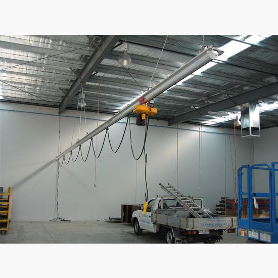 Roof mounted monorail crane with electric hoist