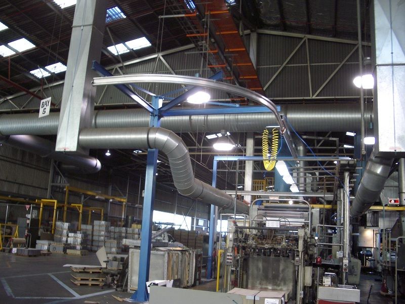 Curved monorail crane retrofitted to existing factory